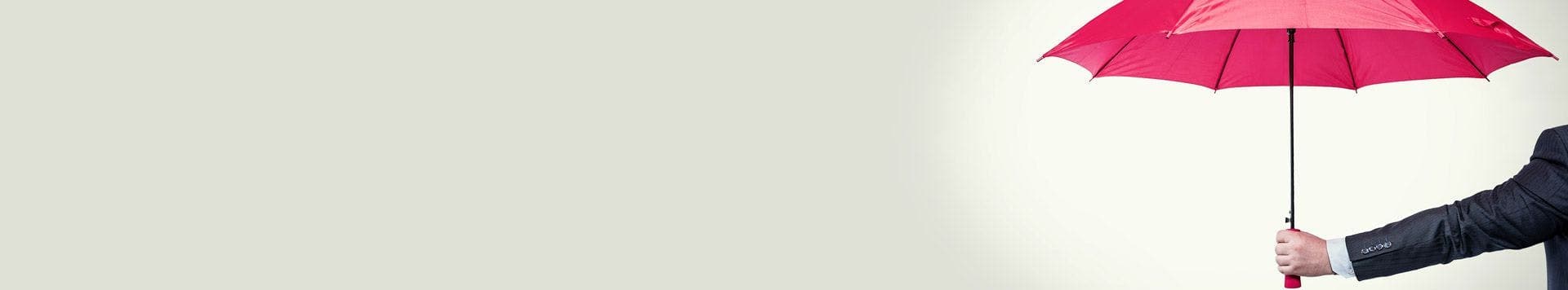 A man holding a red umbrella used as a banner for employment law solicitors