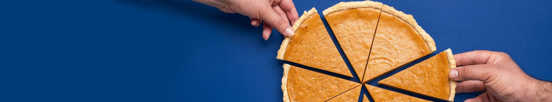 hands picking up pieces of pie