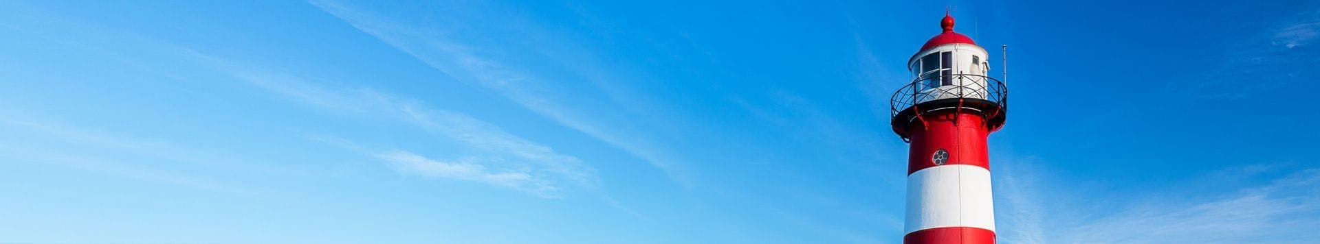 Red lighthouse against a blue sky, used as a banner image for Criminal Defence Solicitors
